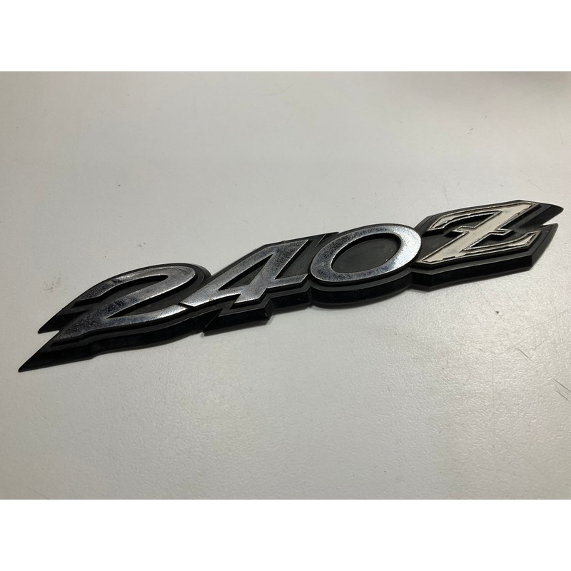 USED # 504 - Rear Hatch ''240z'' Emblem OEM For 70-73 Datsun 240z